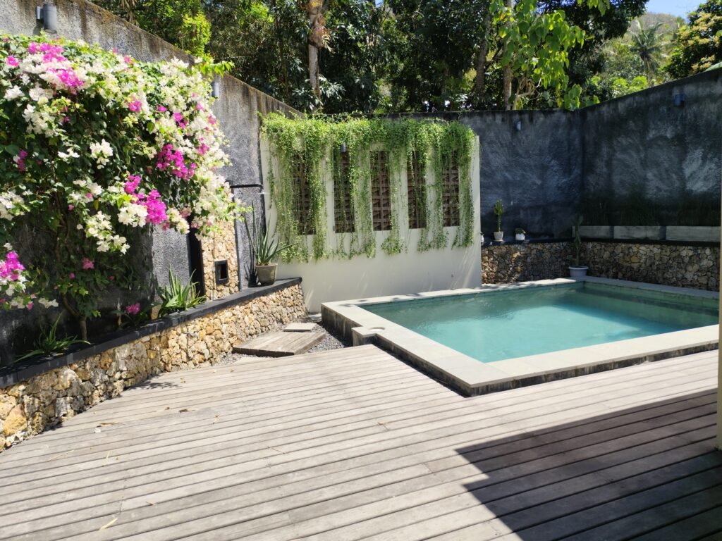 Sakuta Villa at Kalandra Estate, Kuta, Central Lombok – luxury villa with private pool, modern bedrooms, spacious living area, and tropical terrace near Kuta Beach Lombok. Sakuta Villa at Kalandra Estate, luxury villa with private pool in Kuta, Central Lombok Modern bedroom interior at Sakuta Villa Kuta Lombok with tropical ambiance Private swimming pool at Sakuta Villa near Kuta Beach Lombok Spacious living room with tropical garden view at Sakuta Villa Lombok Stylish tropical terrace at Sakuta Villa Kalandra Estate, Central Lombok Luxury villa accommodation in Kuta Lombok – Sakuta Villa private pool view Modern tropical design villa at Kalandra Estate, Kuta, Central Lombok Comfortable bedroom with pool view at Sakuta Villa Kuta Lombok Exotic tropical garden surrounding Sakuta Villa in Central Lombok Romantic sunset view from Sakuta Villa terrace in Kuta Lombok Honeymoon villa with private pool at Kalandra Estate Kuta Lombok Family-friendly luxury villa near Kuta Beach Lombok – Sakuta Villa Open living space with natural light at Sakuta Villa Central Lombok Modern bathroom with tropical design at Sakuta Villa Lombok Aerial view of Sakuta Villa Kalandra Estate near Kuta Beach Lombok, shanti yoga lombok, kuta lombok, villa kuta lombok