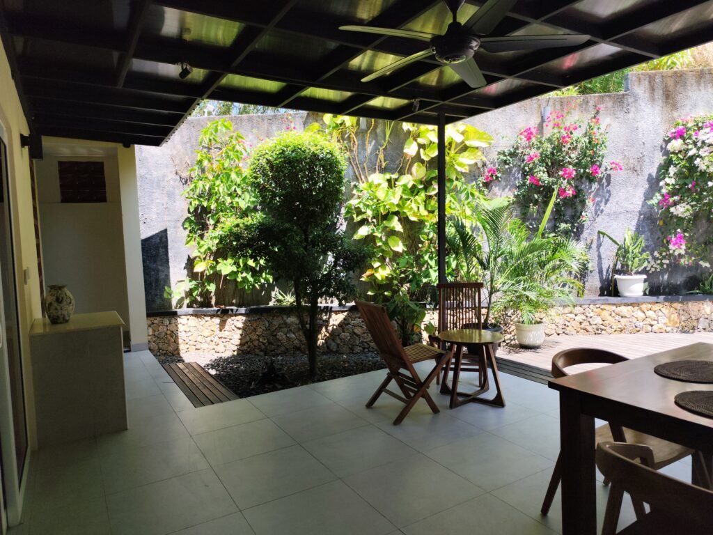 Sakuta Villa at Kalandra Estate, Kuta, Central Lombok – luxury villa with private pool, modern bedrooms, spacious living area, and tropical terrace near Kuta Beach Lombok. Sakuta Villa at Kalandra Estate, luxury villa with private pool in Kuta, Central Lombok Modern bedroom interior at Sakuta Villa Kuta Lombok with tropical ambiance Private swimming pool at Sakuta Villa near Kuta Beach Lombok Spacious living room with tropical garden view at Sakuta Villa Lombok Stylish tropical terrace at Sakuta Villa Kalandra Estate, Central Lombok Luxury villa accommodation in Kuta Lombok – Sakuta Villa private pool view Modern tropical design villa at Kalandra Estate, Kuta, Central Lombok Comfortable bedroom with pool view at Sakuta Villa Kuta Lombok Exotic tropical garden surrounding Sakuta Villa in Central Lombok Romantic sunset view from Sakuta Villa terrace in Kuta Lombok Honeymoon villa with private pool at Kalandra Estate Kuta Lombok Family-friendly luxury villa near Kuta Beach Lombok – Sakuta Villa Open living space with natural light at Sakuta Villa Central Lombok Modern bathroom with tropical design at Sakuta Villa Lombok Aerial view of Sakuta Villa Kalandra Estate near Kuta Beach Lombok, shanti yoga lombok, kuta lombok, villa kuta lombok