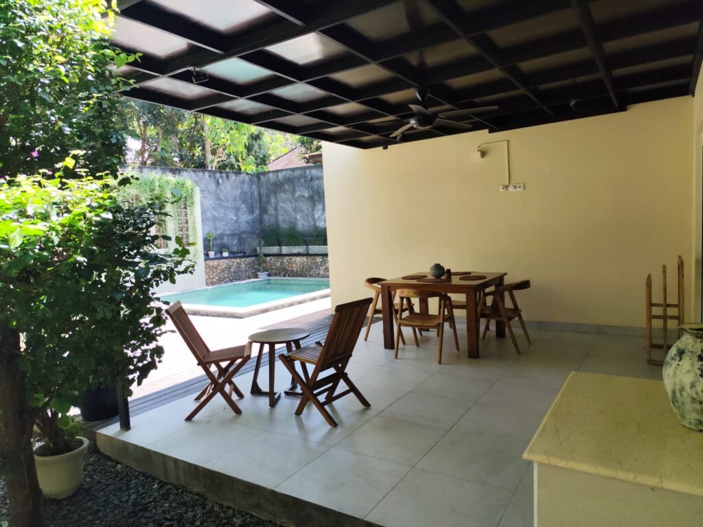 Sakuta Villa at Kalandra Estate, Kuta, Central Lombok – luxury villa with private pool, modern bedrooms, spacious living area, and tropical terrace near Kuta Beach Lombok. Sakuta Villa at Kalandra Estate, luxury villa with private pool in Kuta, Central Lombok Modern bedroom interior at Sakuta Villa Kuta Lombok with tropical ambiance Private swimming pool at Sakuta Villa near Kuta Beach Lombok Spacious living room with tropical garden view at Sakuta Villa Lombok Stylish tropical terrace at Sakuta Villa Kalandra Estate, Central Lombok Luxury villa accommodation in Kuta Lombok – Sakuta Villa private pool view Modern tropical design villa at Kalandra Estate, Kuta, Central Lombok Comfortable bedroom with pool view at Sakuta Villa Kuta Lombok Exotic tropical garden surrounding Sakuta Villa in Central Lombok Romantic sunset view from Sakuta Villa terrace in Kuta Lombok Honeymoon villa with private pool at Kalandra Estate Kuta Lombok Family-friendly luxury villa near Kuta Beach Lombok – Sakuta Villa Open living space with natural light at Sakuta Villa Central Lombok Modern bathroom with tropical design at Sakuta Villa Lombok Aerial view of Sakuta Villa Kalandra Estate near Kuta Beach Lombok, shanti yoga lombok, kuta lombok, villa kuta lombok