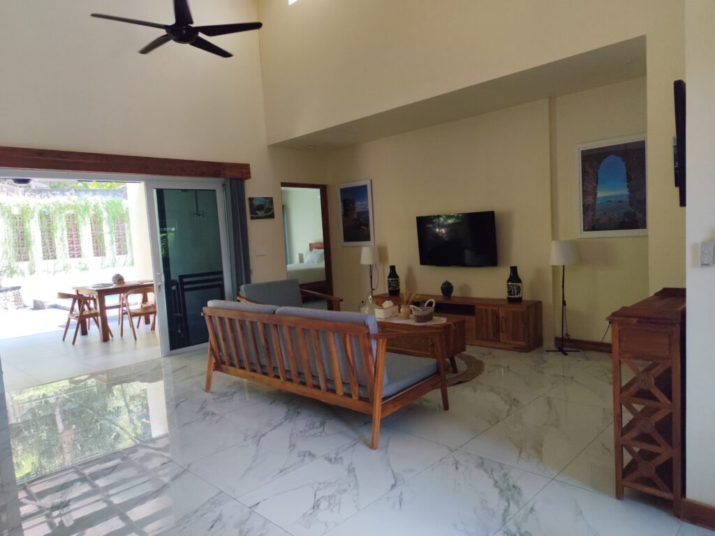 Sakuta Villa at Kalandra Estate, Kuta, Central Lombok – luxury villa with private pool, modern bedrooms, spacious living area, and tropical terrace near Kuta Beach Lombok. Sakuta Villa at Kalandra Estate, luxury villa with private pool in Kuta, Central Lombok Modern bedroom interior at Sakuta Villa Kuta Lombok with tropical ambiance Private swimming pool at Sakuta Villa near Kuta Beach Lombok Spacious living room with tropical garden view at Sakuta Villa Lombok Stylish tropical terrace at Sakuta Villa Kalandra Estate, Central Lombok Luxury villa accommodation in Kuta Lombok – Sakuta Villa private pool view Modern tropical design villa at Kalandra Estate, Kuta, Central Lombok Comfortable bedroom with pool view at Sakuta Villa Kuta Lombok Exotic tropical garden surrounding Sakuta Villa in Central Lombok Romantic sunset view from Sakuta Villa terrace in Kuta Lombok Honeymoon villa with private pool at Kalandra Estate Kuta Lombok Family-friendly luxury villa near Kuta Beach Lombok – Sakuta Villa Open living space with natural light at Sakuta Villa Central Lombok Modern bathroom with tropical design at Sakuta Villa Lombok Aerial view of Sakuta Villa Kalandra Estate near Kuta Beach Lombok, shanti yoga lombok, kuta lombok, villa kuta lombok