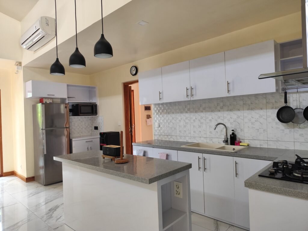 Sakuta Villa at Kalandra Estate, Kuta, Central Lombok – luxury villa with private pool, modern bedrooms, spacious living area, and tropical terrace near Kuta Beach Lombok. Sakuta Villa at Kalandra Estate, luxury villa with private pool in Kuta, Central Lombok Modern bedroom interior at Sakuta Villa Kuta Lombok with tropical ambiance Private swimming pool at Sakuta Villa near Kuta Beach Lombok Spacious living room with tropical garden view at Sakuta Villa Lombok Stylish tropical terrace at Sakuta Villa Kalandra Estate, Central Lombok Luxury villa accommodation in Kuta Lombok – Sakuta Villa private pool view Modern tropical design villa at Kalandra Estate, Kuta, Central Lombok Comfortable bedroom with pool view at Sakuta Villa Kuta Lombok Exotic tropical garden surrounding Sakuta Villa in Central Lombok Romantic sunset view from Sakuta Villa terrace in Kuta Lombok Honeymoon villa with private pool at Kalandra Estate Kuta Lombok Family-friendly luxury villa near Kuta Beach Lombok – Sakuta Villa Open living space with natural light at Sakuta Villa Central Lombok Modern bathroom with tropical design at Sakuta Villa Lombok Aerial view of Sakuta Villa Kalandra Estate near Kuta Beach Lombok, shanti yoga lombok, kuta lombok, villa kuta lombok