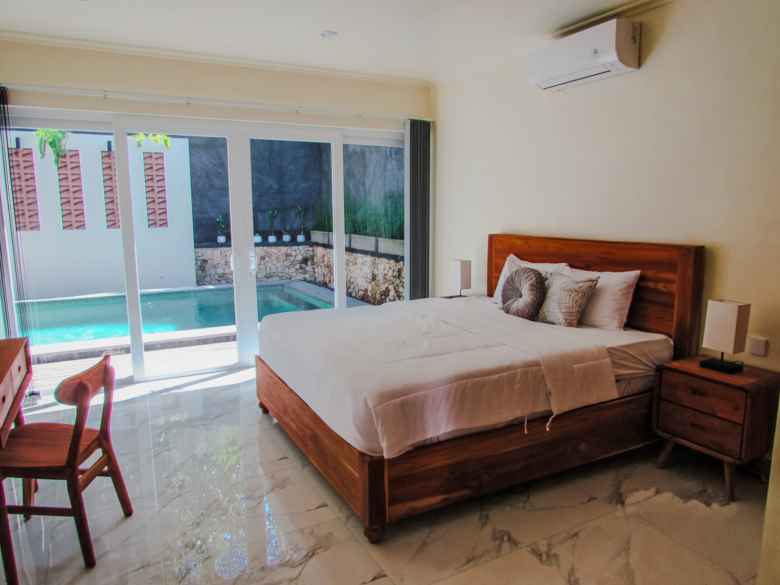 Sakuta Villa at Kalandra Estate, Kuta, Central Lombok – luxury villa with private pool, modern bedrooms, spacious living area, and tropical terrace near Kuta Beach Lombok. Sakuta Villa at Kalandra Estate, luxury villa with private pool in Kuta, Central Lombok Modern bedroom interior at Sakuta Villa Kuta Lombok with tropical ambiance Private swimming pool at Sakuta Villa near Kuta Beach Lombok Spacious living room with tropical garden view at Sakuta Villa Lombok Stylish tropical terrace at Sakuta Villa Kalandra Estate, Central Lombok Luxury villa accommodation in Kuta Lombok – Sakuta Villa private pool view Modern tropical design villa at Kalandra Estate, Kuta, Central Lombok Comfortable bedroom with pool view at Sakuta Villa Kuta Lombok Exotic tropical garden surrounding Sakuta Villa in Central Lombok Romantic sunset view from Sakuta Villa terrace in Kuta Lombok Honeymoon villa with private pool at Kalandra Estate Kuta Lombok Family-friendly luxury villa near Kuta Beach Lombok – Sakuta Villa Open living space with natural light at Sakuta Villa Central Lombok Modern bathroom with tropical design at Sakuta Villa Lombok Aerial view of Sakuta Villa Kalandra Estate near Kuta Beach Lombok, shanti yoga lombok, kuta lombok, villa kuta lombok